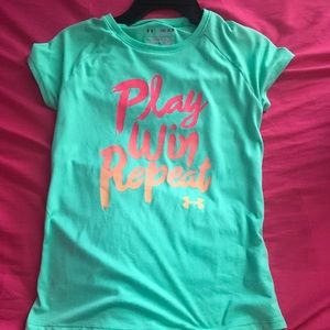 A blue under armor shirt for girls